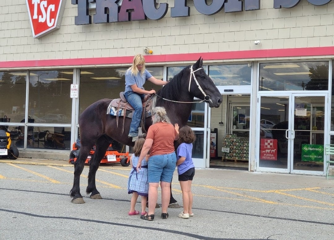 People with horse at Tractor Supply